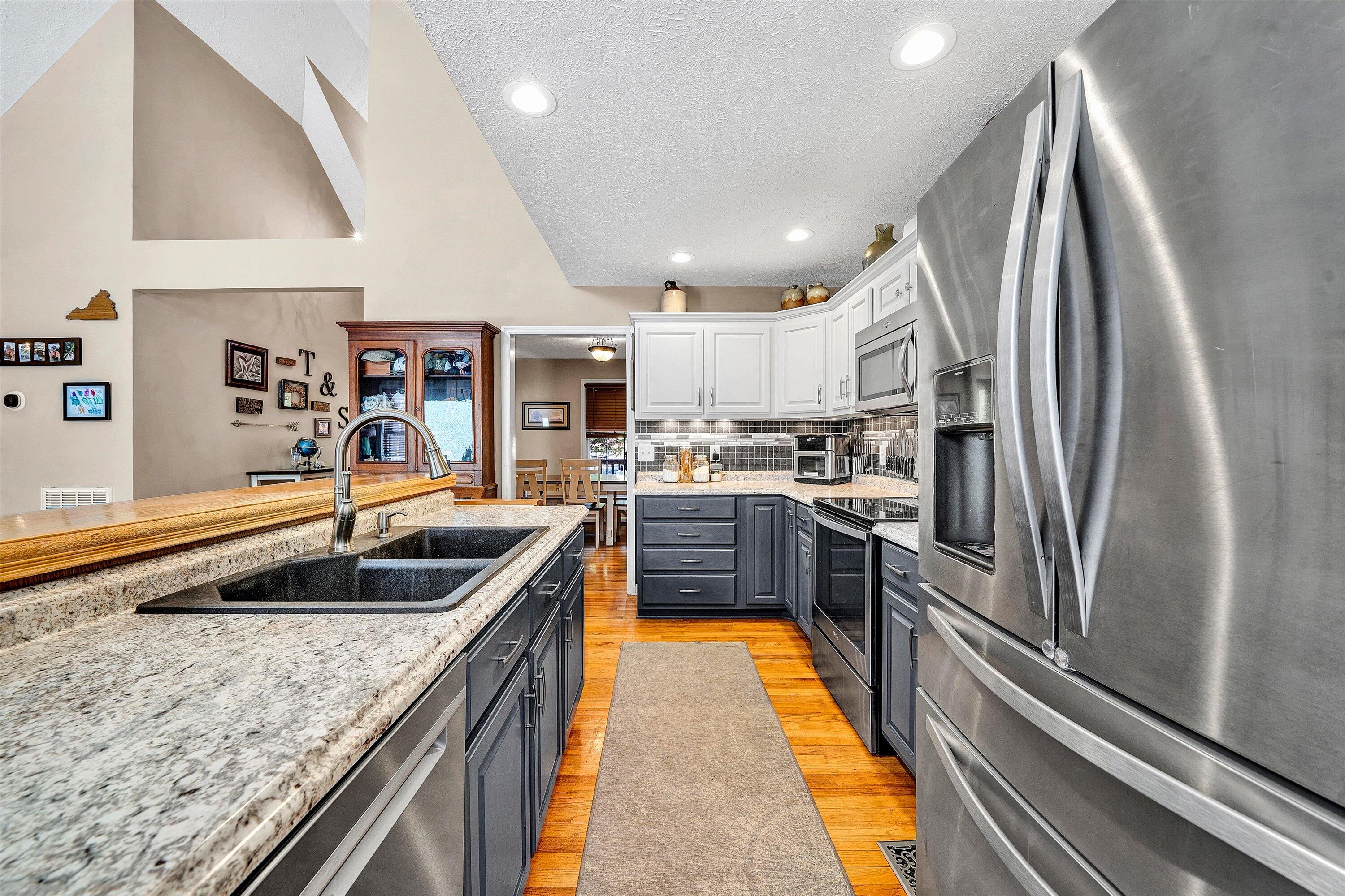 1422 Isolane Road Callaway, VA 24067 - Photo 15 of 39 a kitchen with stainless steel appliances granite countertop a sink and a refrigerator
