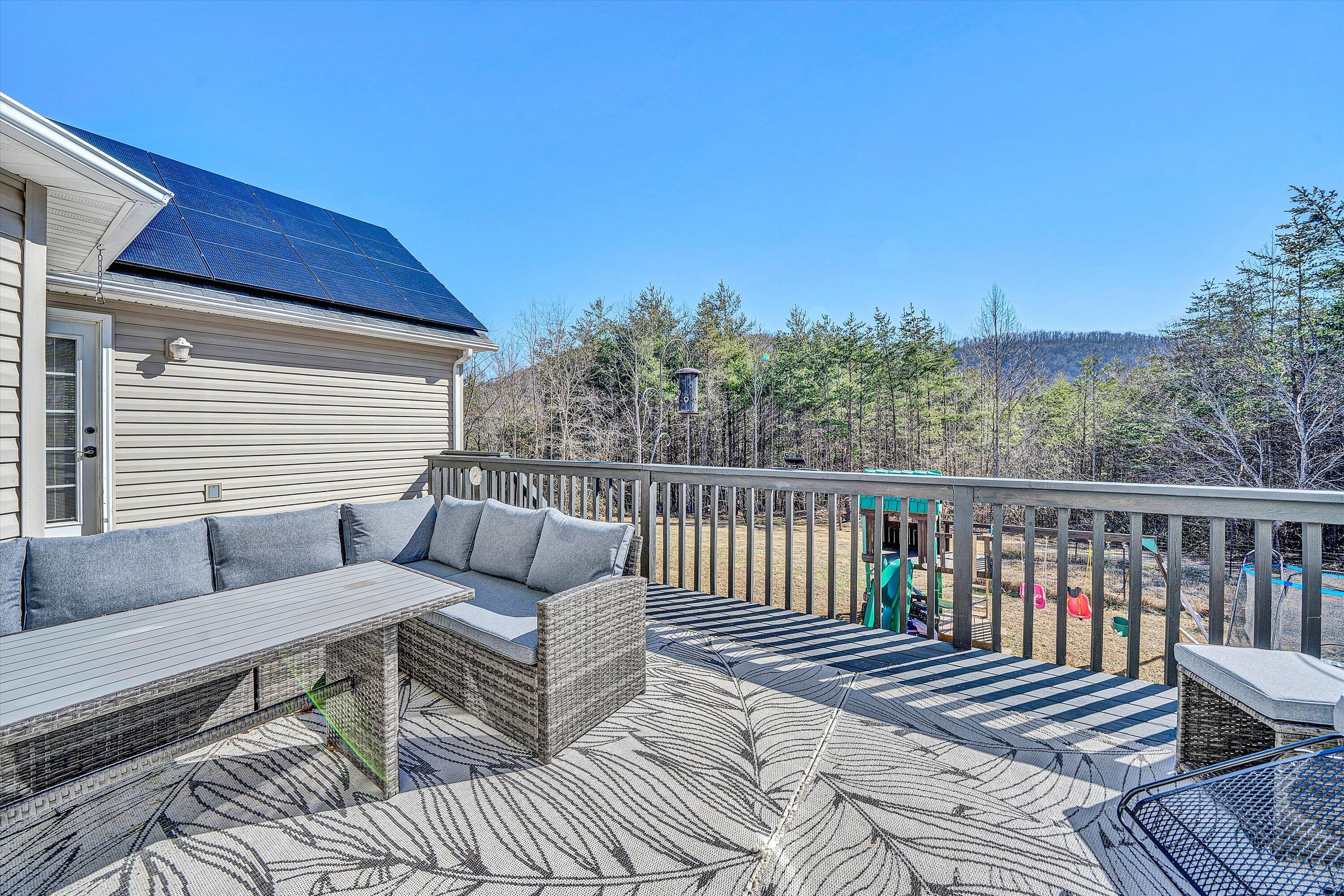 1422 Isolane Road Callaway, VA 24067 - Photo 37 of 39 a roof deck with couches and wooden floor