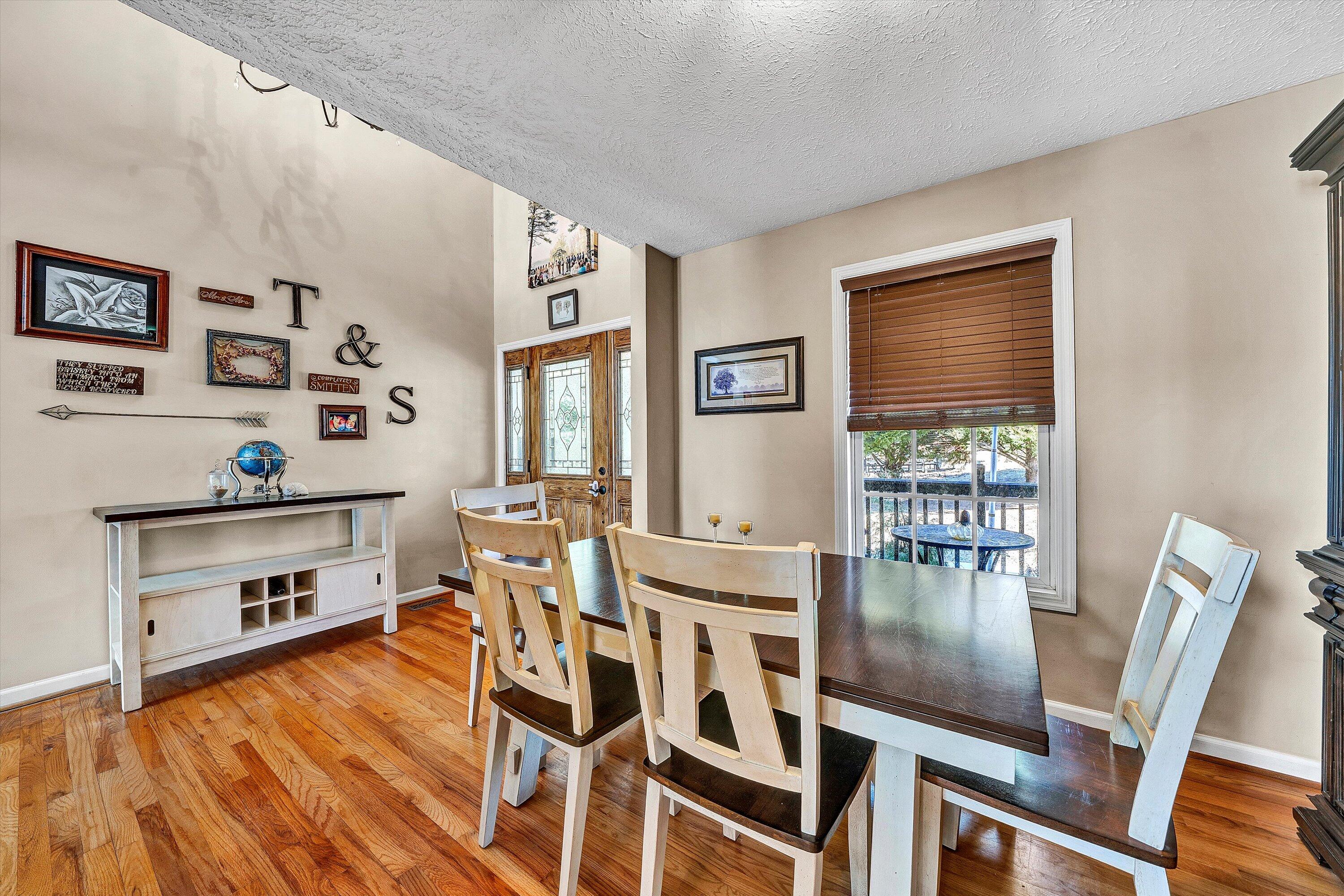 1422 Isolane Road Callaway, VA 24067 - Photo 6 of 39 a dining room with wooden floor and large window
