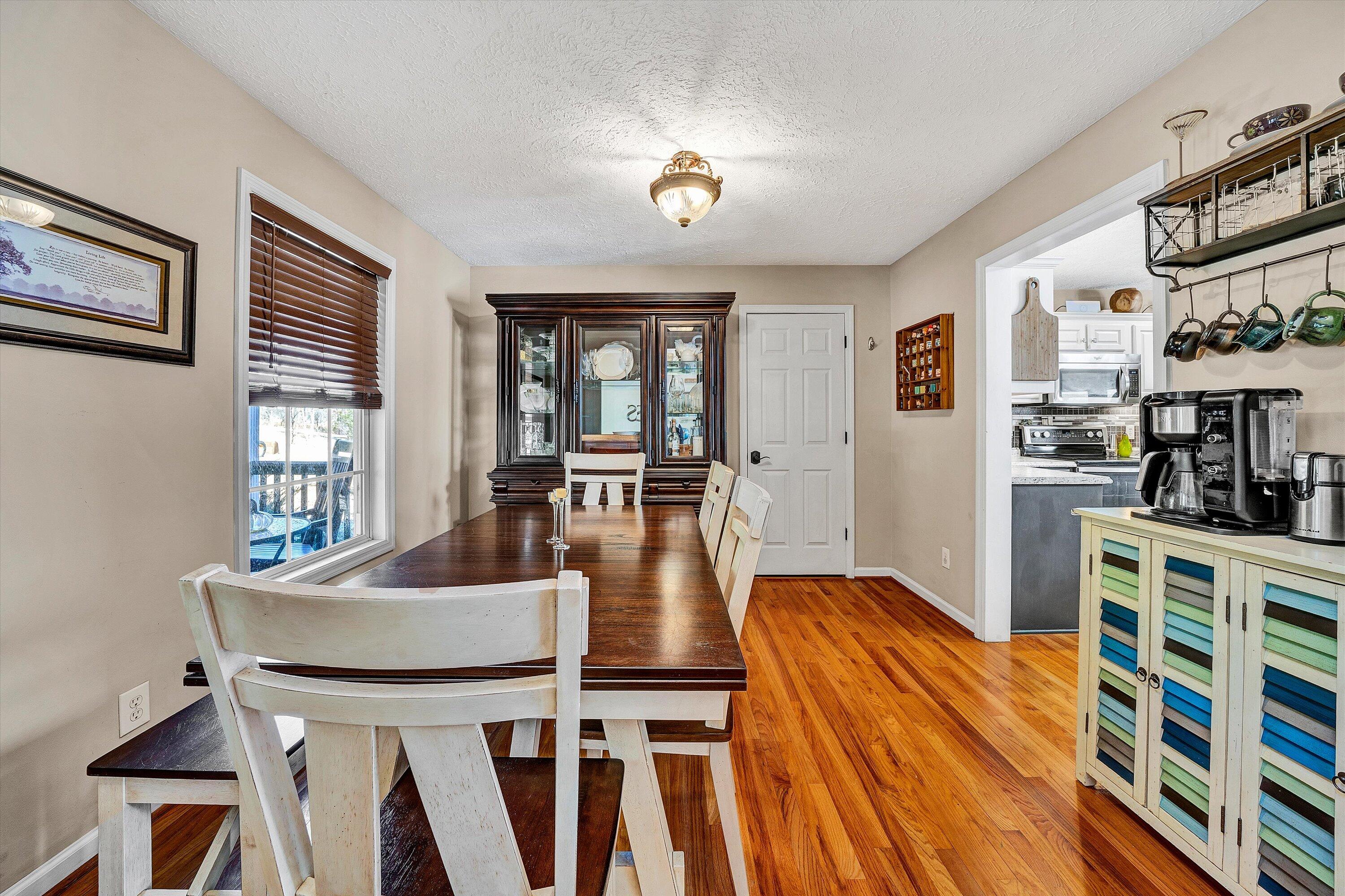 1422 Isolane Road Callaway, VA 24067 - Photo 7 of 39 a view of a dining room with furniture window and wooden floor