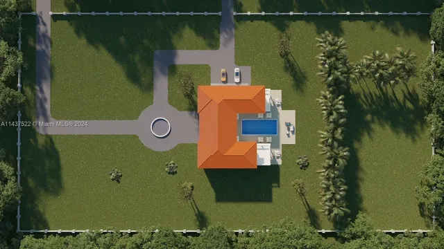 an aerial view of a house with a yard lake swimming pool and outdoor seating