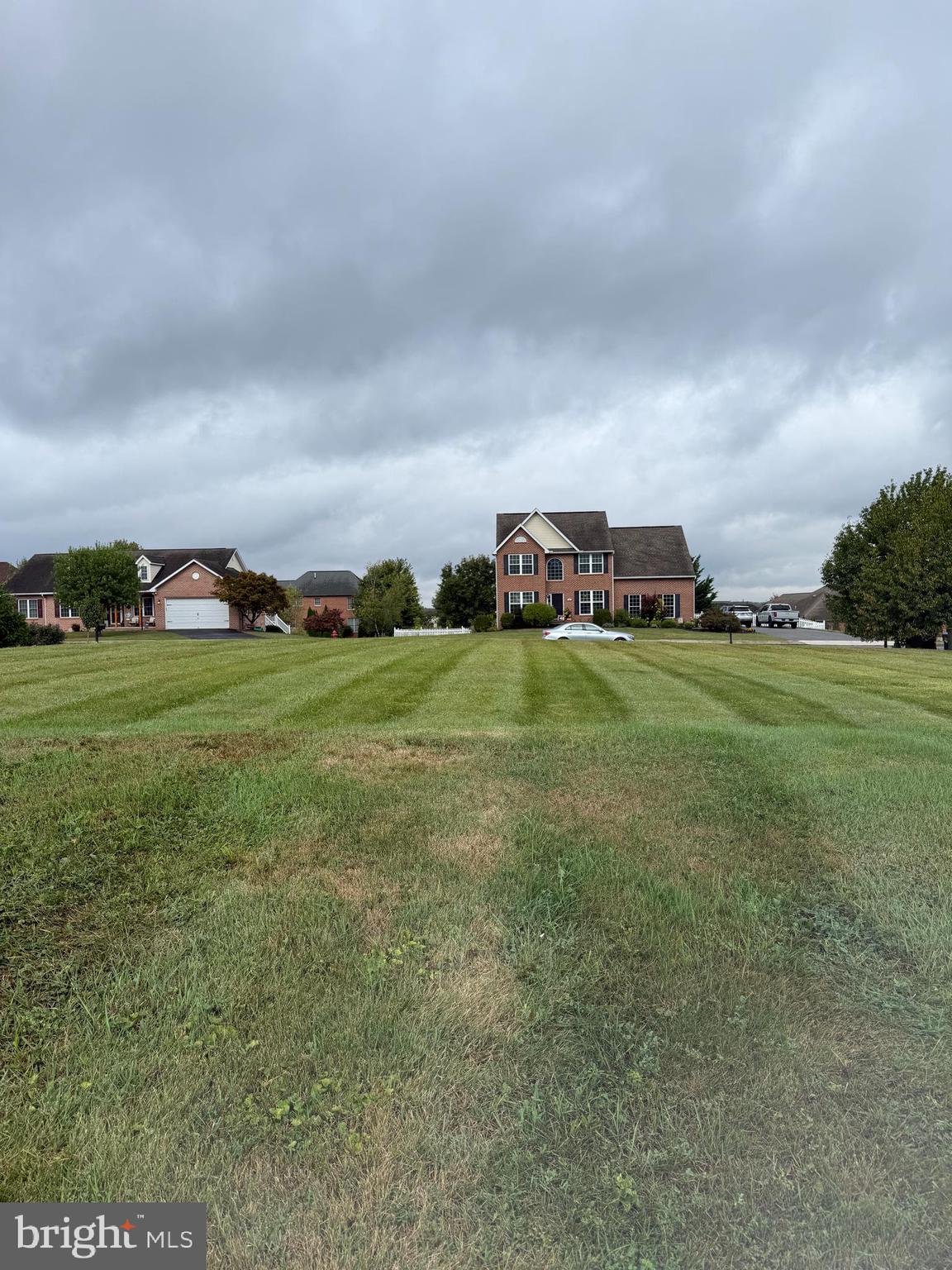 Celestial Terrace Greencastle, PA 17225 - Photo 6 of 6 a view of a field with lawn chairs and large trees