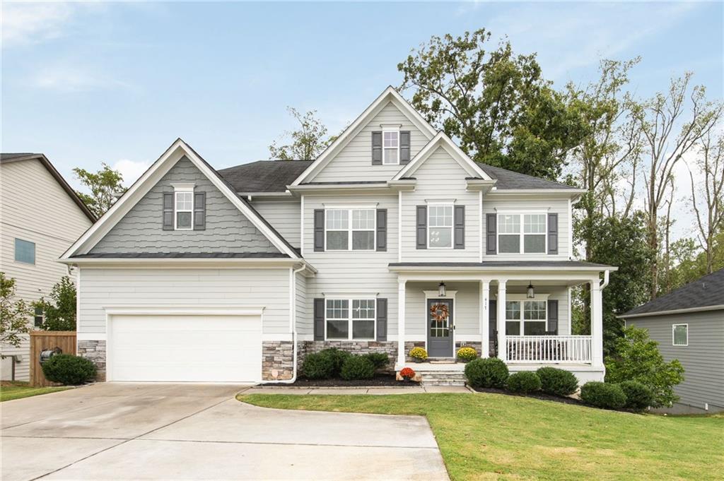 a front view of a house with garden