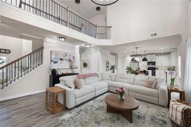 a living room with furniture a fireplace and a window