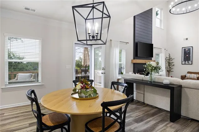 a kitchen with a stove a sink a microwave and cabinets