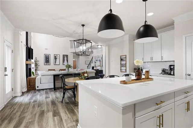 a view of a hallway with windows and stairs