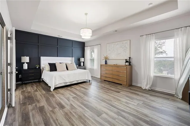 a bedroom with furniture and a window