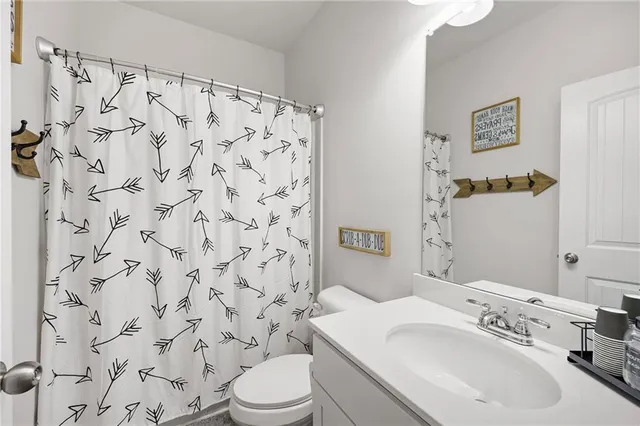 a kitchen with a sink a counter and chairs