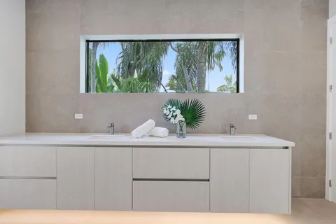 a view of an empty room with a cabinet