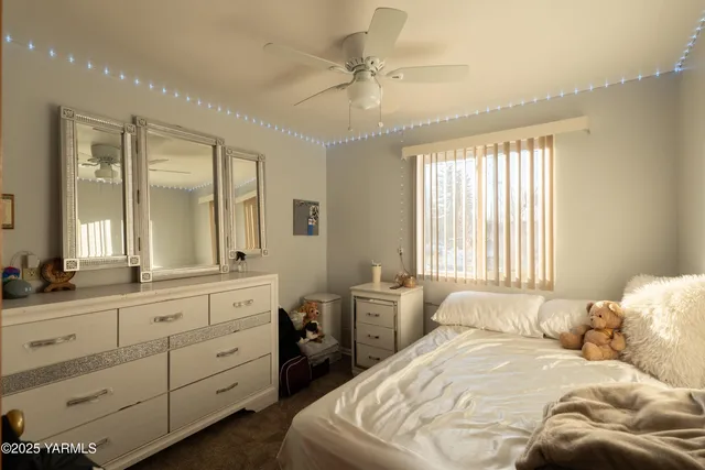 a bed room with a bed and a chandelier