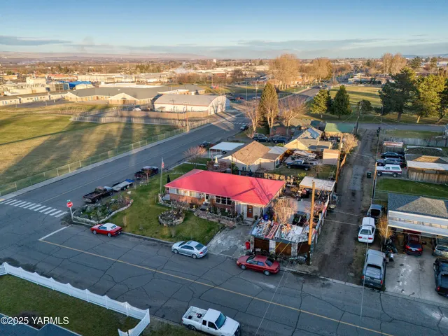 an aerial view of residential houses with outdoor space