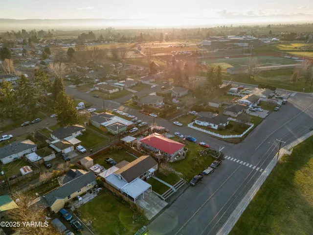 an aerial view of residential houses with outdoor space