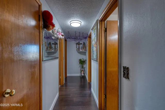 a view of hallway with wooden floor