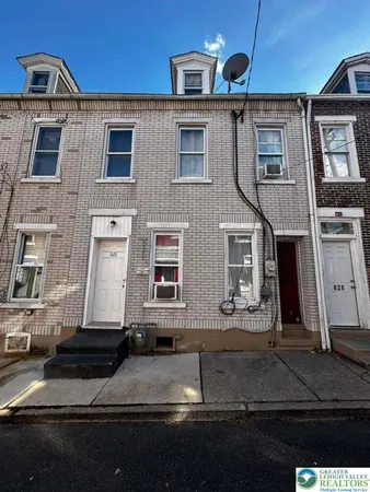 a front view of a house with street