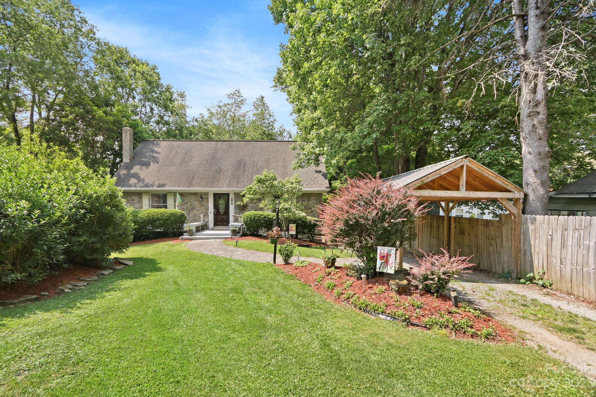 270 Pine Street Boone, NC 28607 - Photo 1 of 47 a view of a house with backyard and sitting area