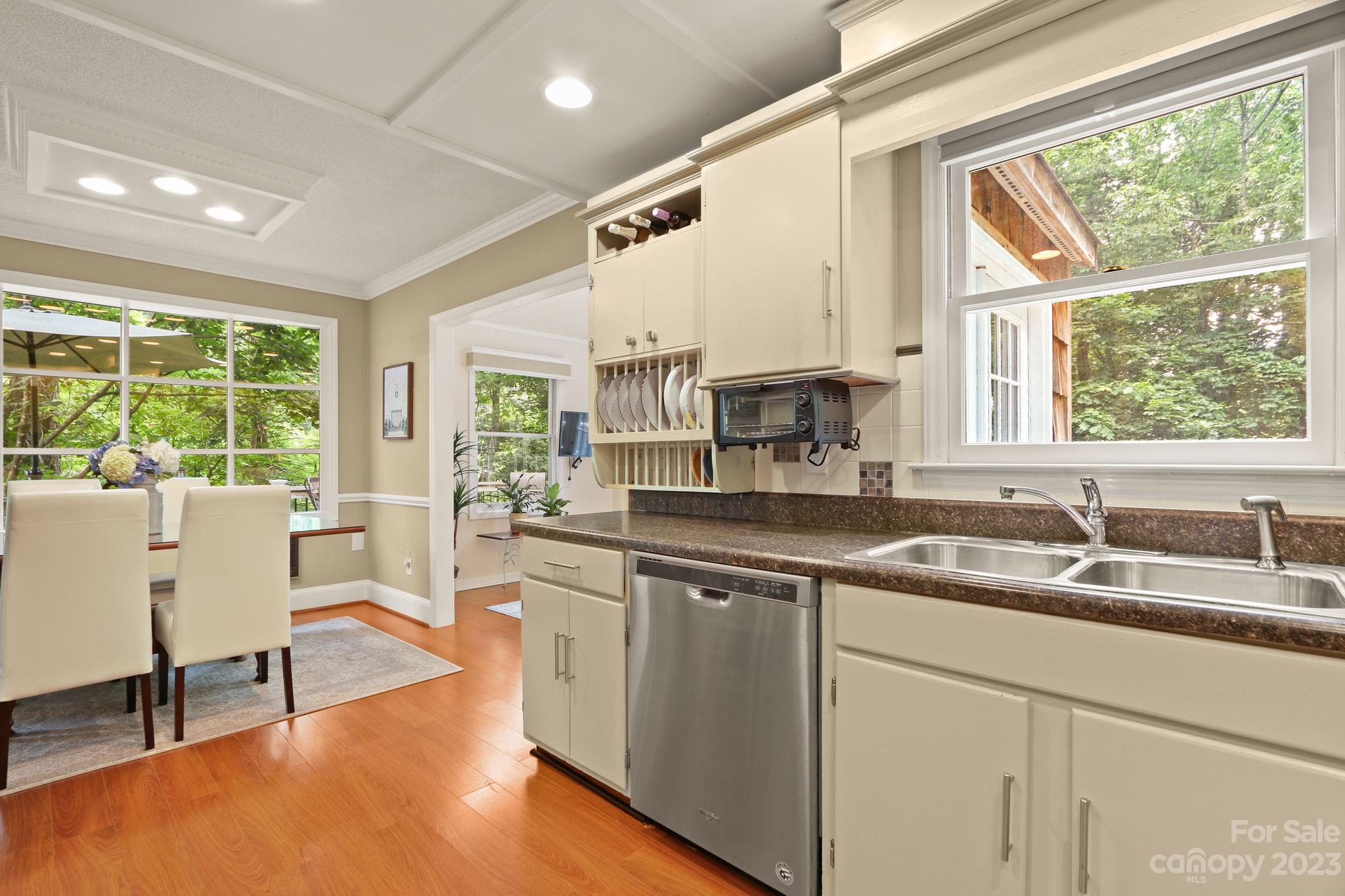 270 Pine Street Boone, NC 28607 - Photo 13 of 47 a large white kitchen with a large window