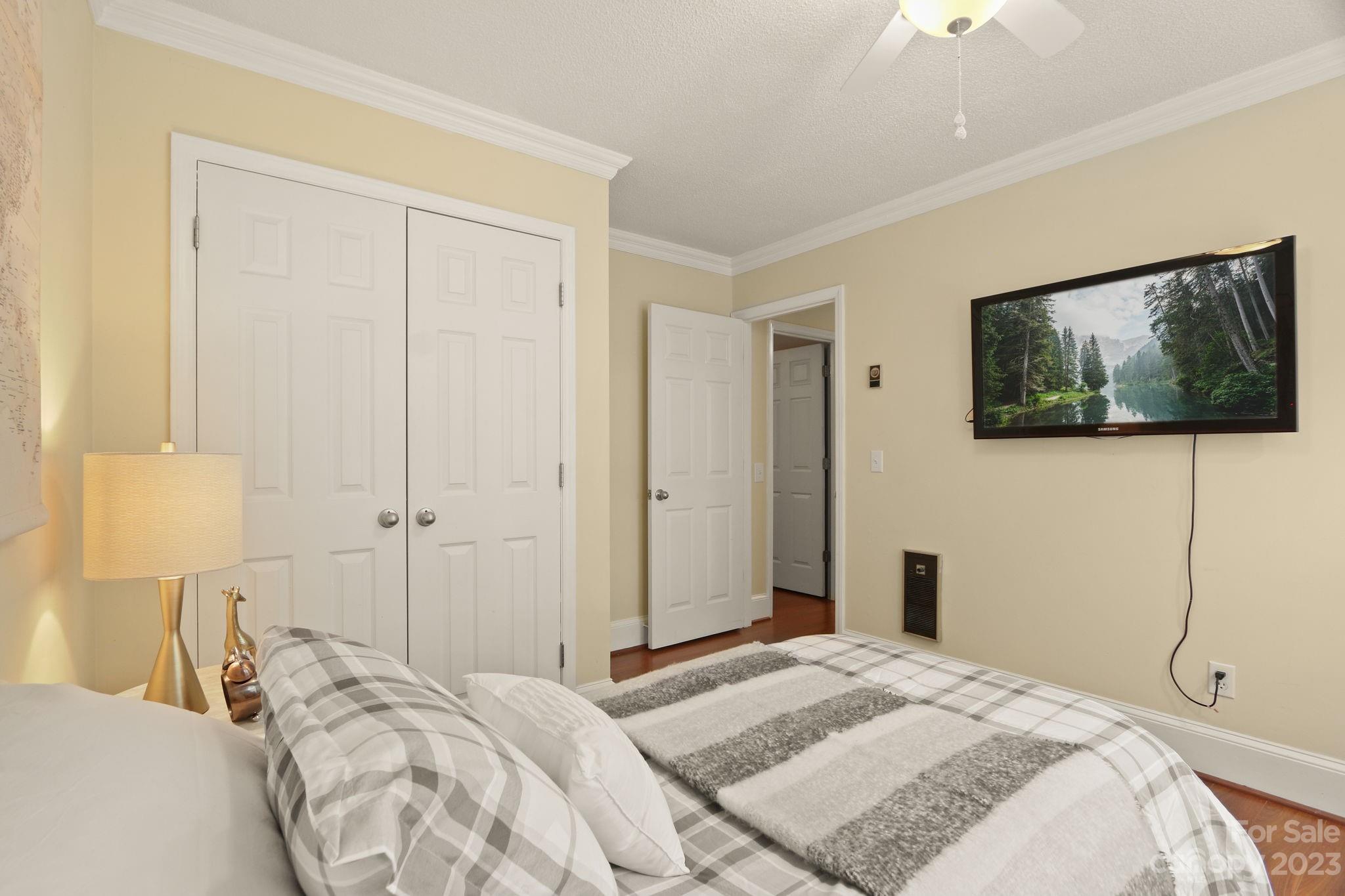 270 Pine Street Boone, NC 28607 - Photo 26 of 47 a bedroom with a bed and a flat screen tv