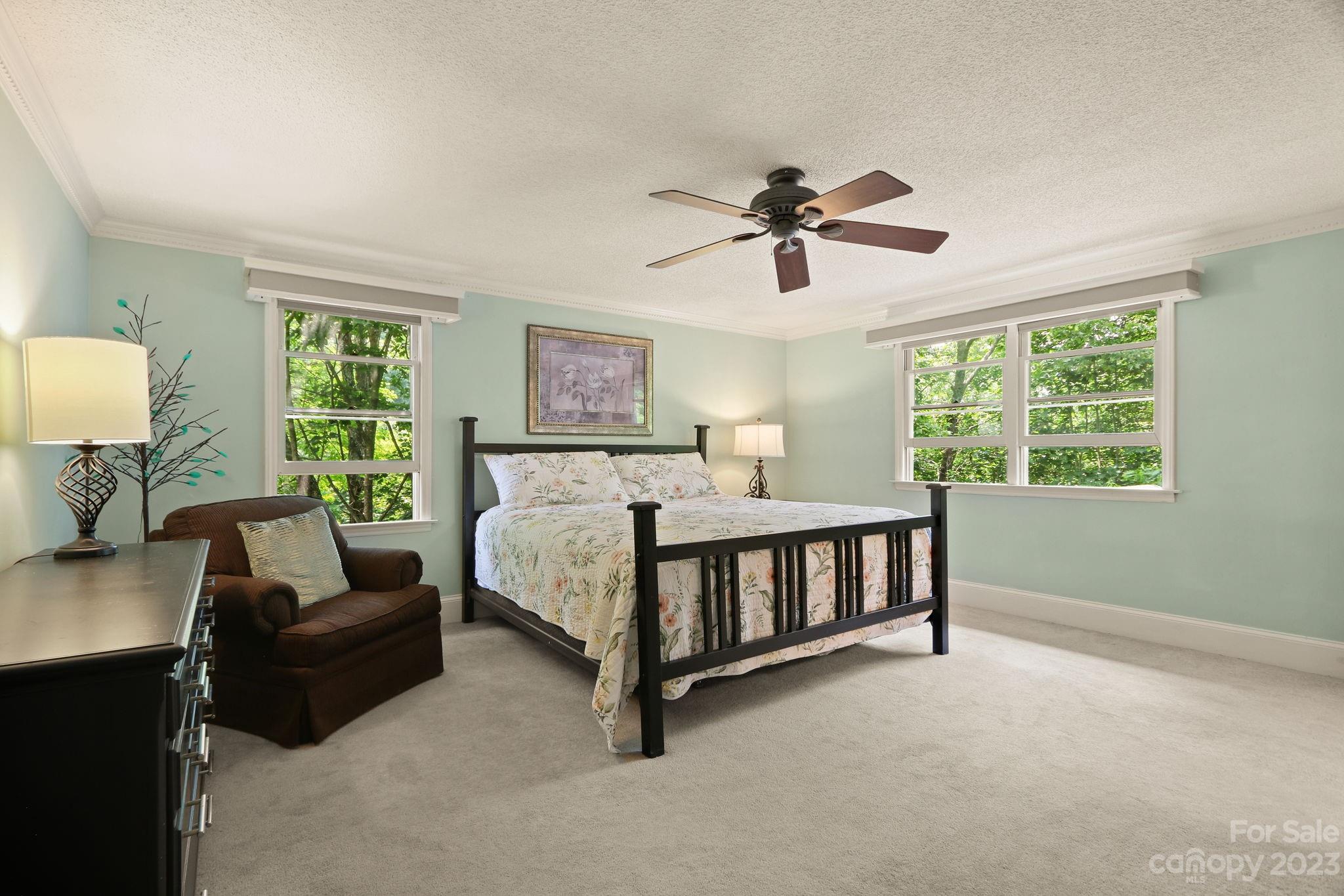 270 Pine Street Boone, NC 28607 - Photo 27 of 47 a bedroom with a bed a couch and a window