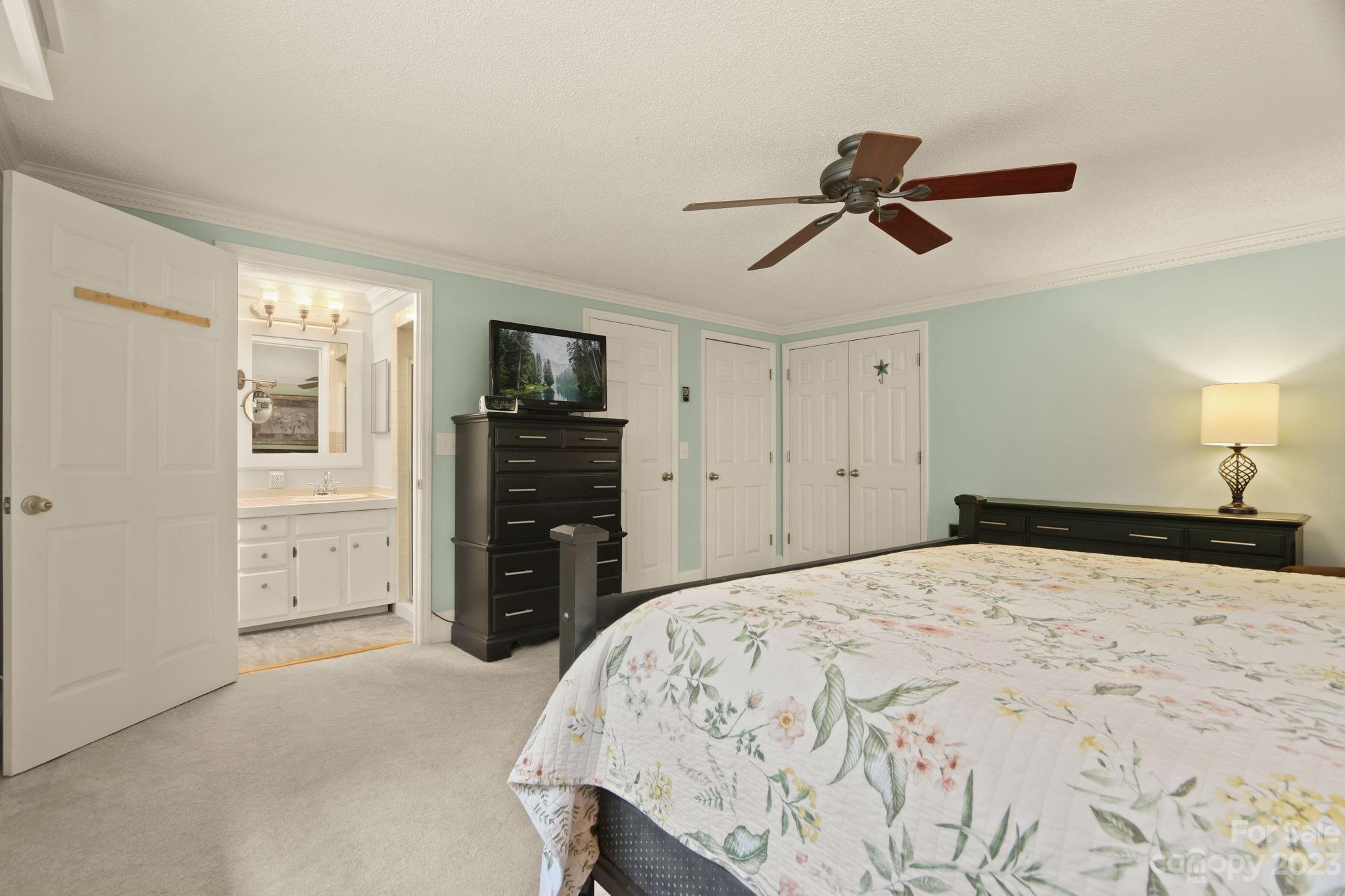 270 Pine Street Boone, NC 28607 - Photo 28 of 47 a bedroom with a bed and a walk in closet