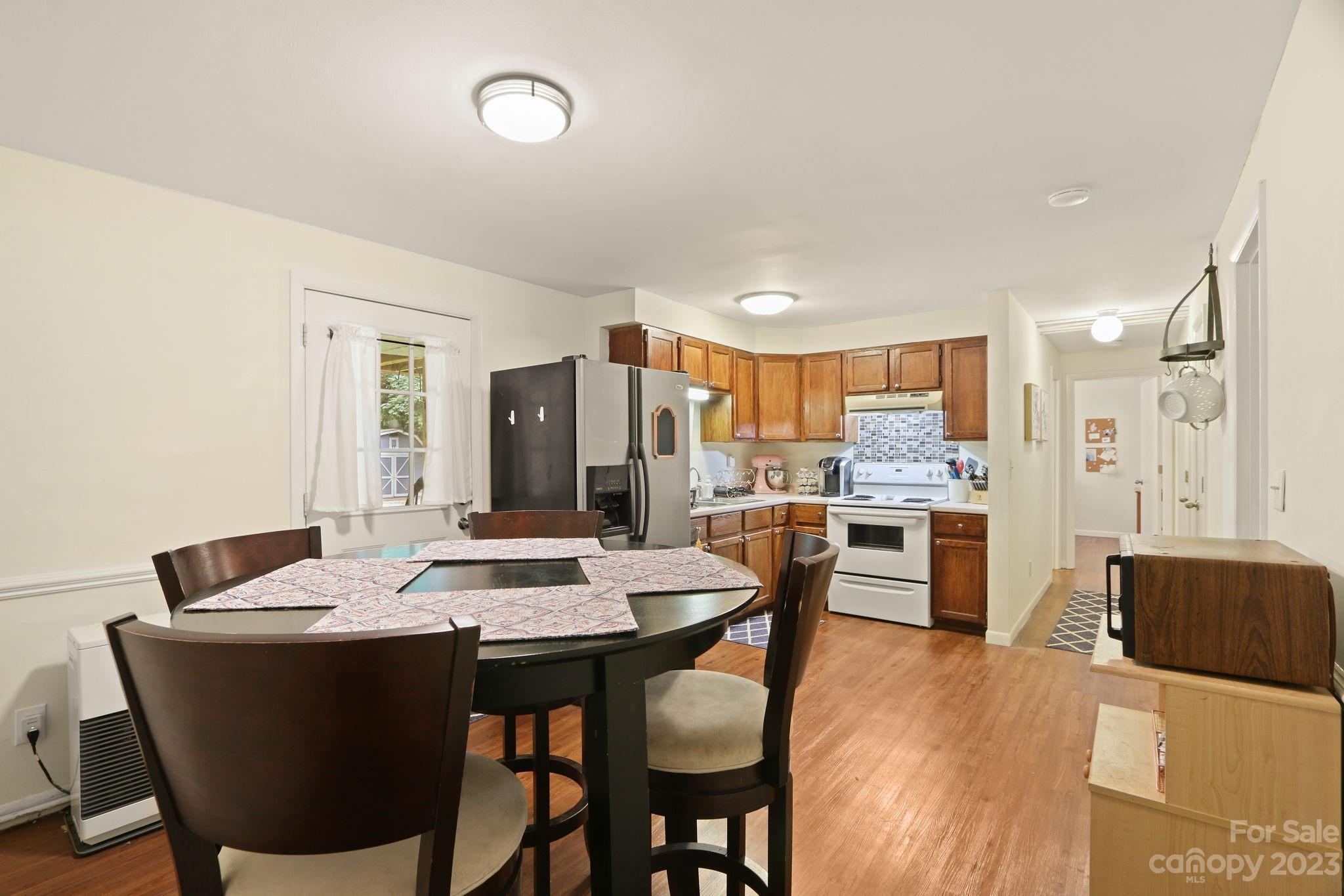 270 Pine Street Boone, NC 28607 - Photo 37 of 47 a view of a dining room with furniture and a kitchen