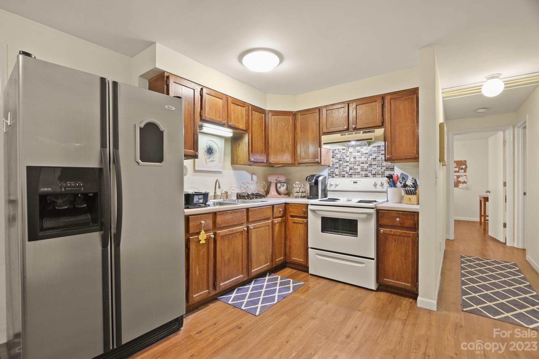 270 Pine Street Boone, NC 28607 - Photo 38 of 47 a kitchen with stainless steel appliances a refrigerator sink and cabinets