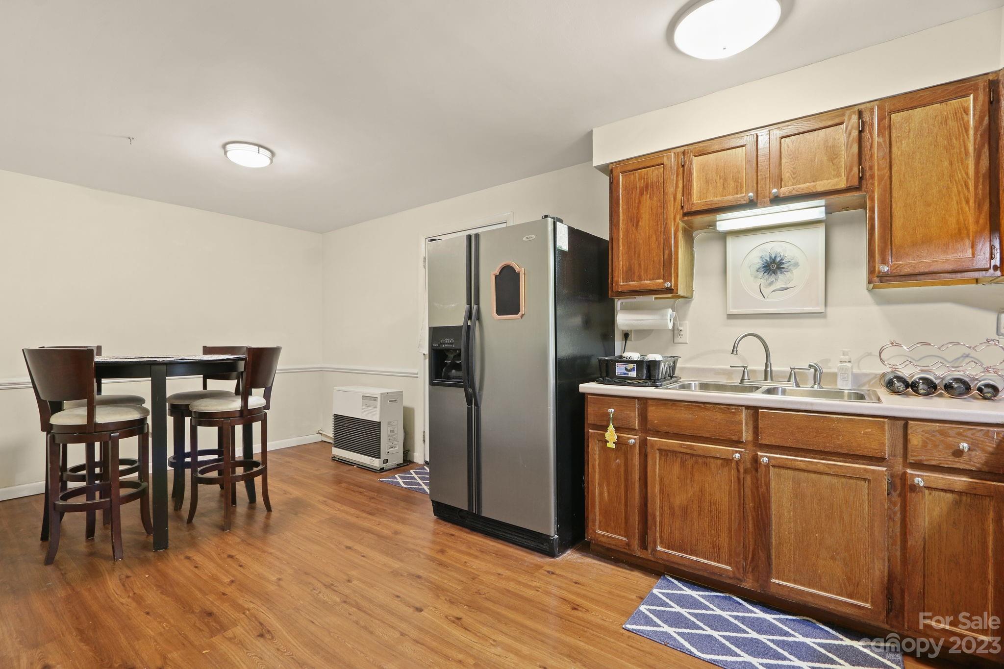 270 Pine Street Boone, NC 28607 - Photo 39 of 47 a kitchen with stainless steel appliances granite countertop a refrigerator and microwave