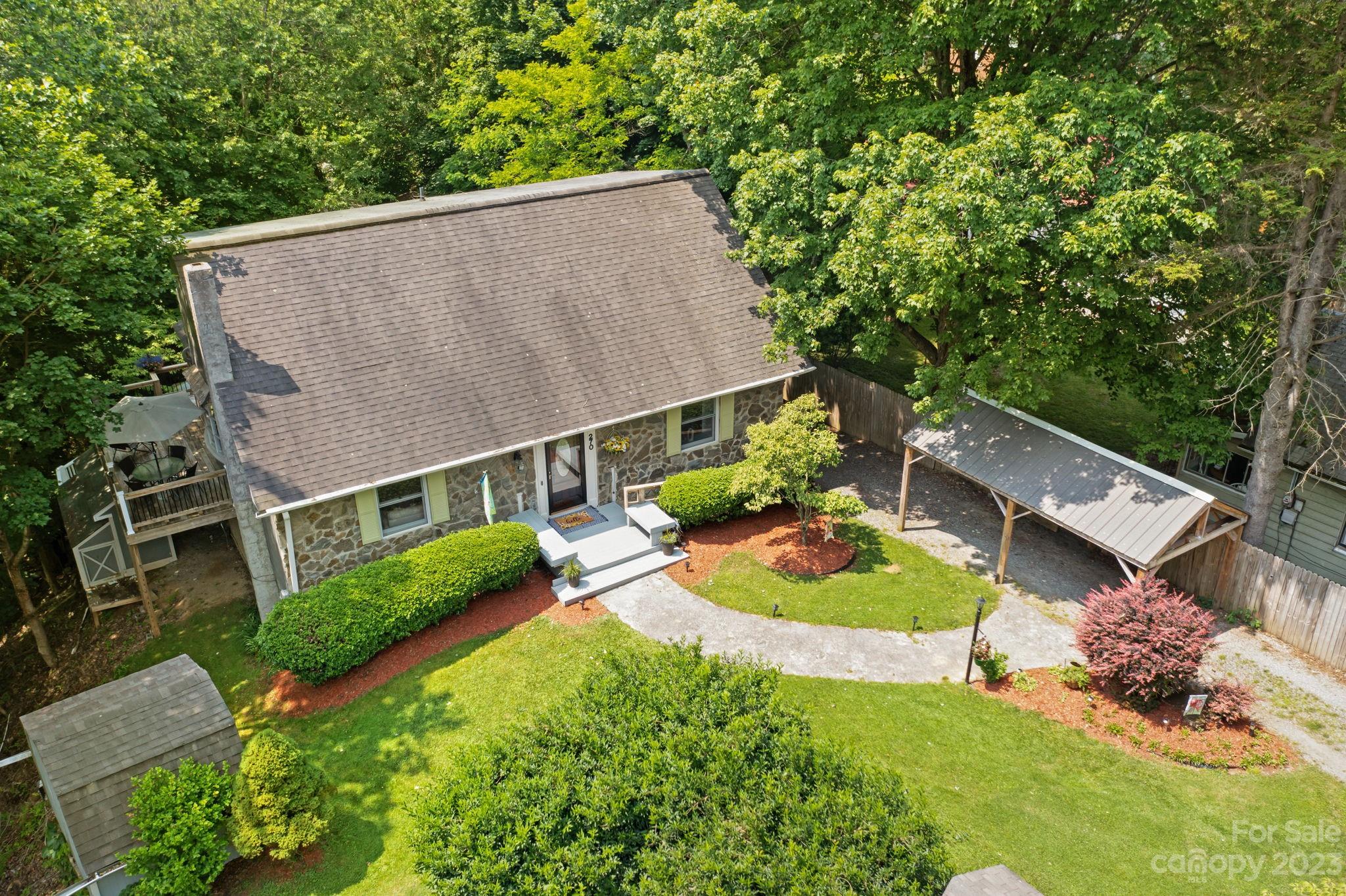 270 Pine Street Boone, NC 28607 - Photo 46 of 47 an aerial view of a house with a garden and lake view