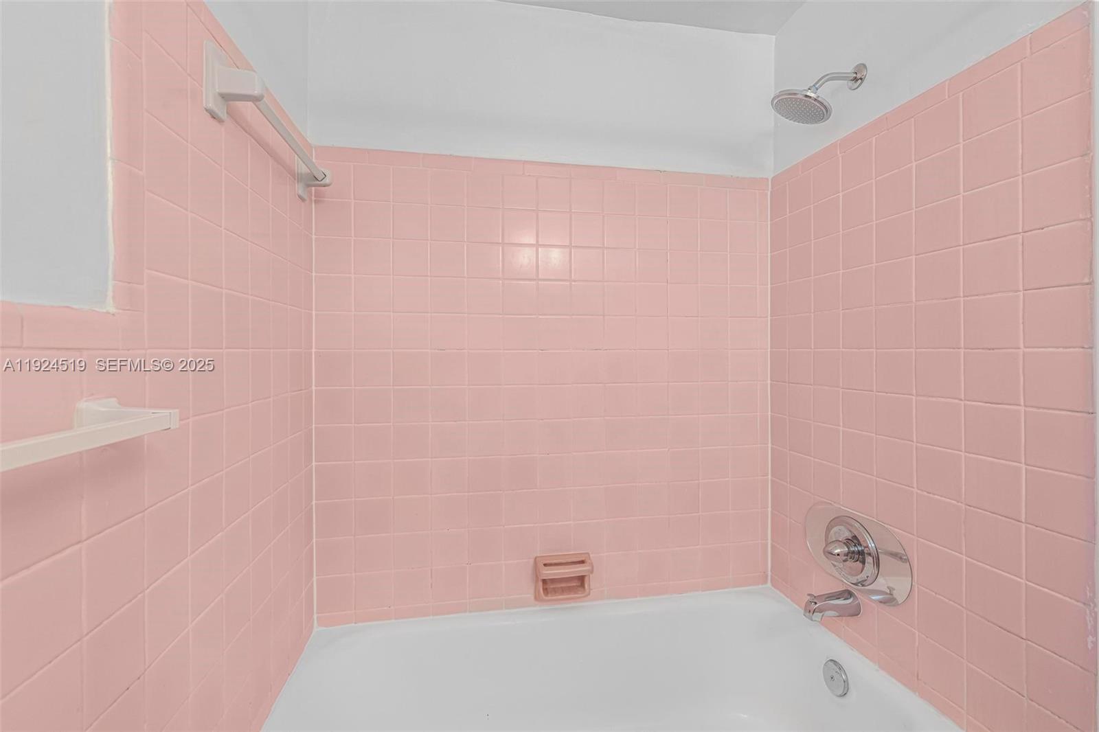 1850 Meridian Avenue, Unit 7 Miami Beach, FL 33139 - Photo 13 of 24 a bathroom with a white bath tub and a shower