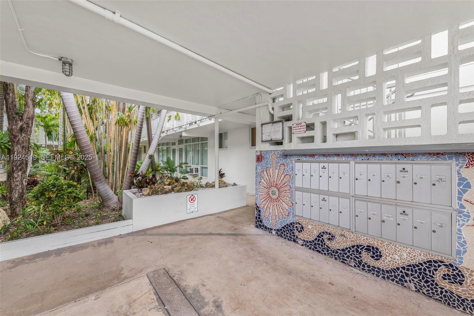 1850 Meridian Avenue, Unit 7 Miami Beach, FL 33139 - Photo 18 of 24 a view of a room with racks on the wall