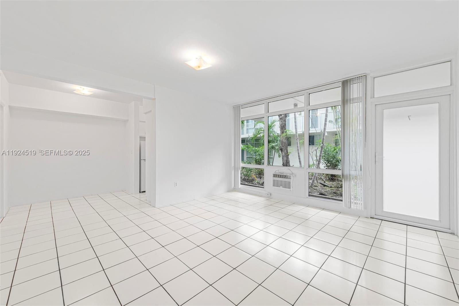 1850 Meridian Avenue, Unit 7 Miami Beach, FL 33139 - Photo 3 of 24 a view of an empty room and window