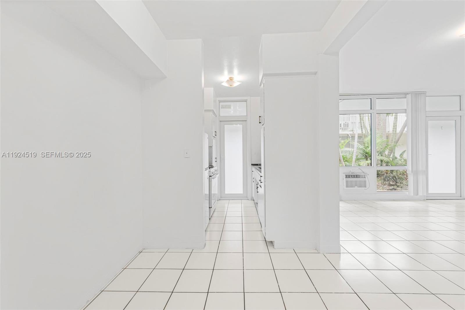 1850 Meridian Avenue, Unit 7 Miami Beach, FL 33139 - Photo 7 of 24 a view of an empty room and window