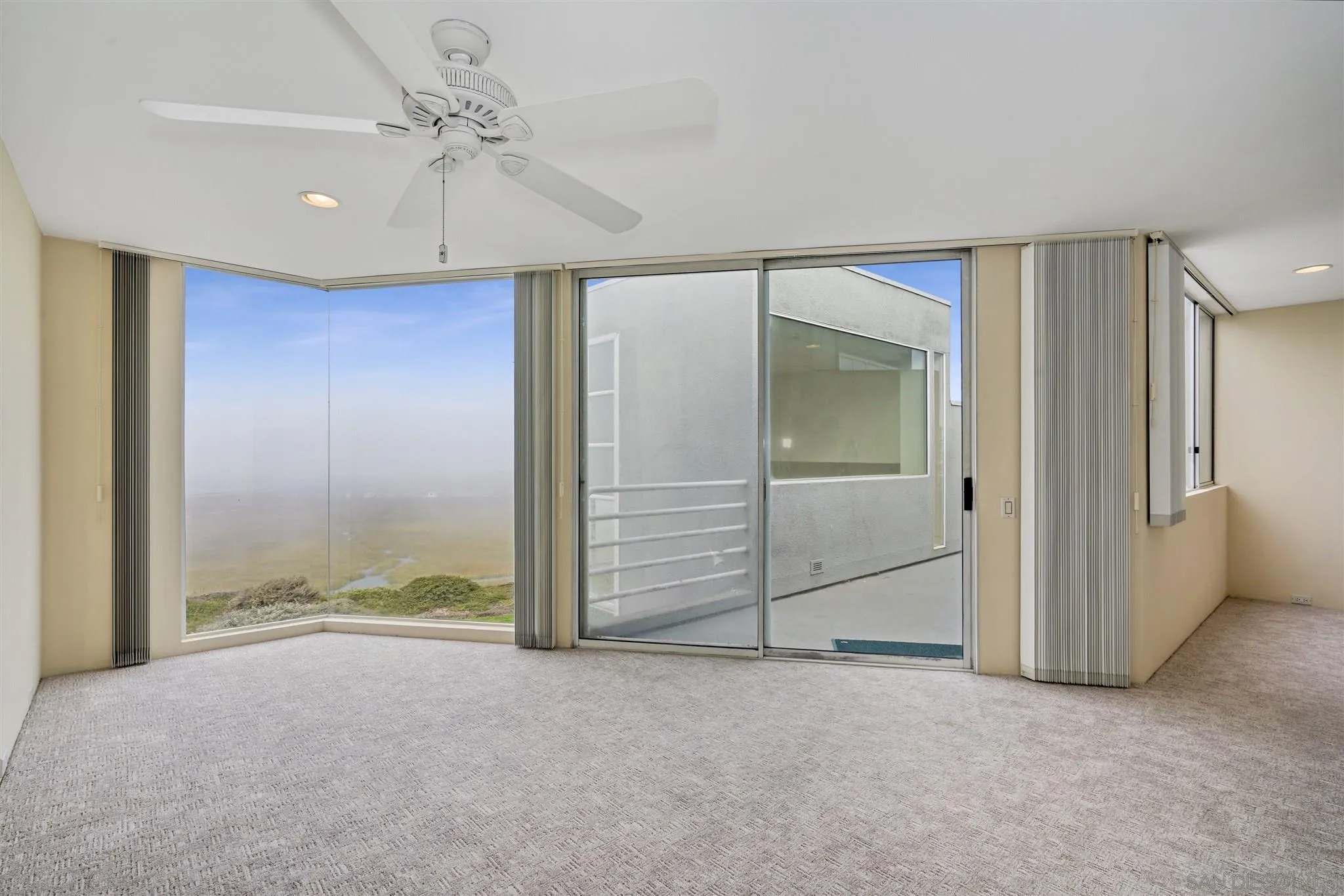 166 Solana Point Circle Solana Beach, CA 92075 - Photo 9 of 20 an empty room with a ceiling fan