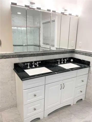 a stove top oven sitting inside of a kitchen