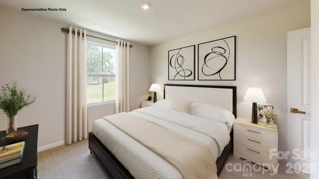 a bedroom with a bed and a potted plant