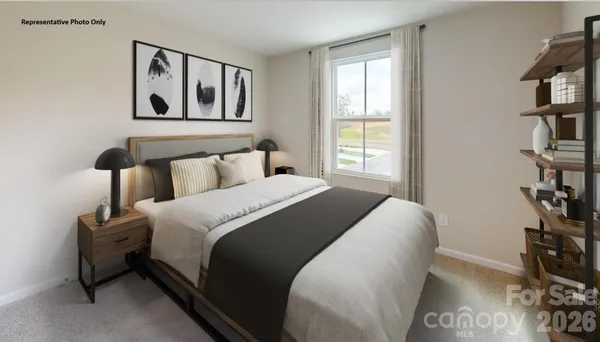 a bedroom with a bed and a book shelf