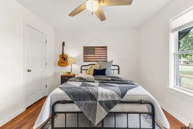 a bedroom with a bed and window