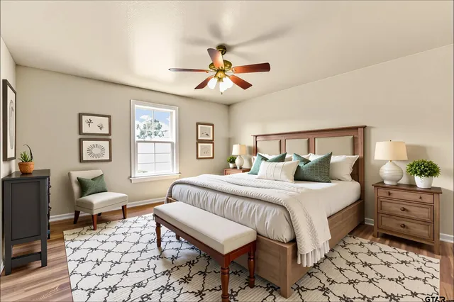 a bedroom with a bed and a window