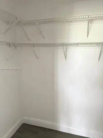 a view of a room with racks on the wall