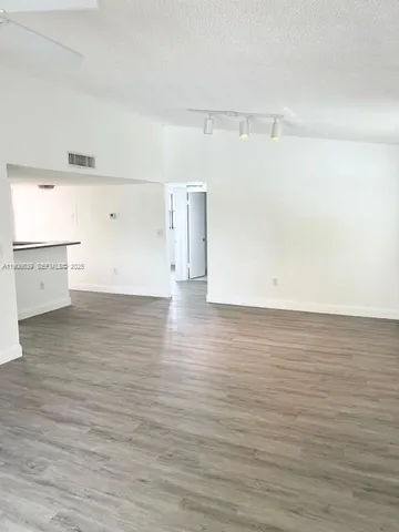 a view of room and wooden floor