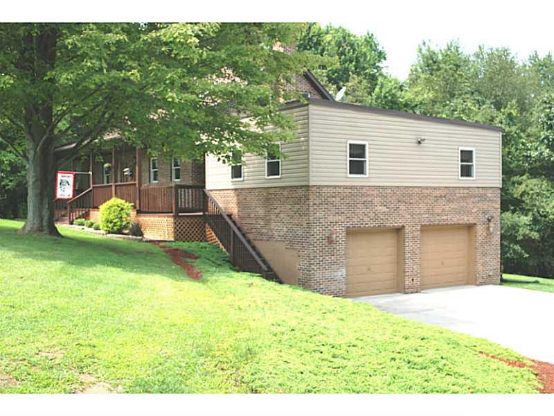 141 Sportsman Lane Rochester, PA 15074 - Photo 21 of 25 Exterior Front. Addition is the huge living room! Cement pad driveway!