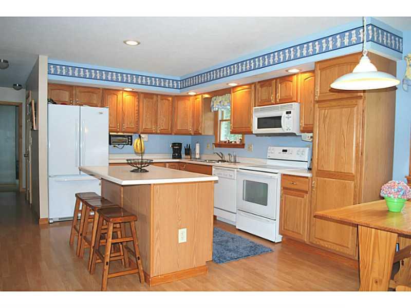 141 Sportsman Lane Rochester, PA 15074 - Photo 6 of 25 Kitchen. Very spacious kitchen with center island/bar area! Laminate wood flooring. All appliances included!