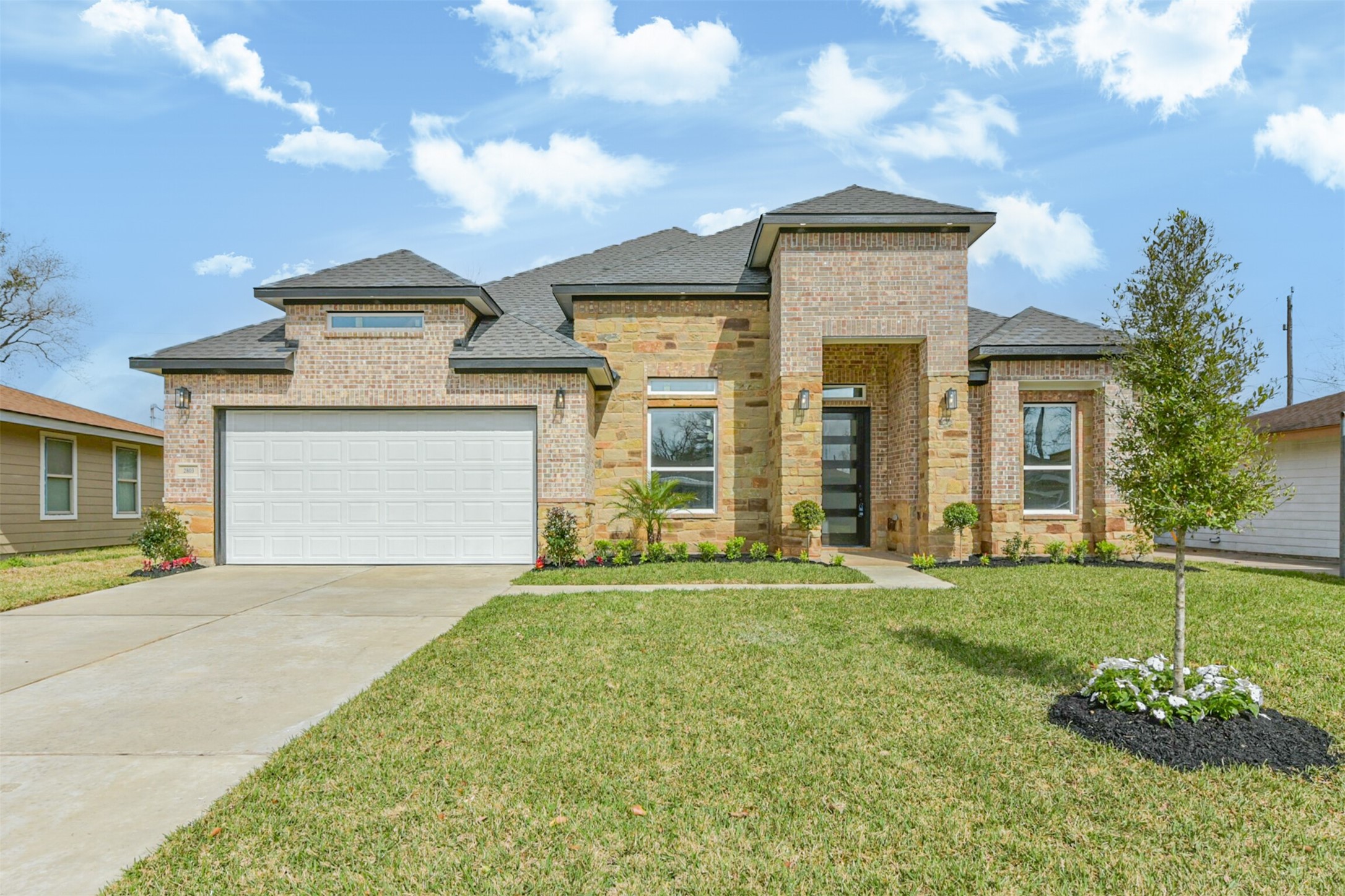 a front view of a house with a yard