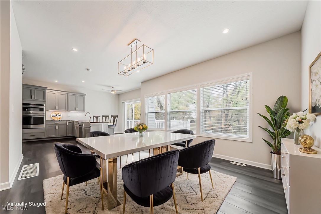 5270 Brainard Road Solon, OH 44139 - Photo 7 of 45 Virtually Staged-breakfast/dining area with dark wood finished floors, recessed lighting, and beautiful chandelier