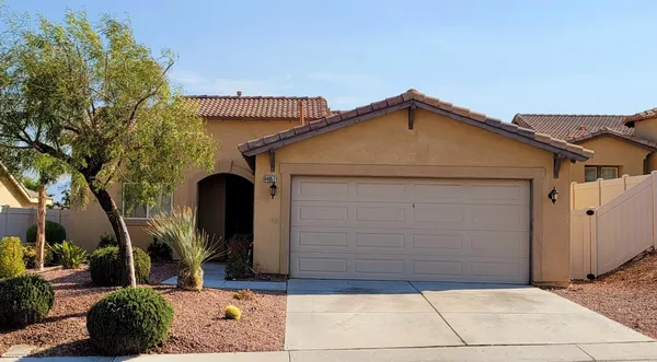 a front view of a house with garage