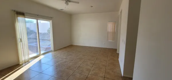 a view of an empty room and window in a room