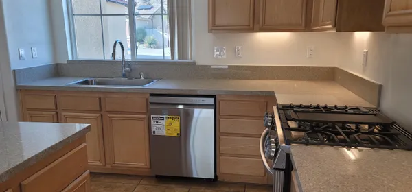 a kitchen with a sink and cabinets