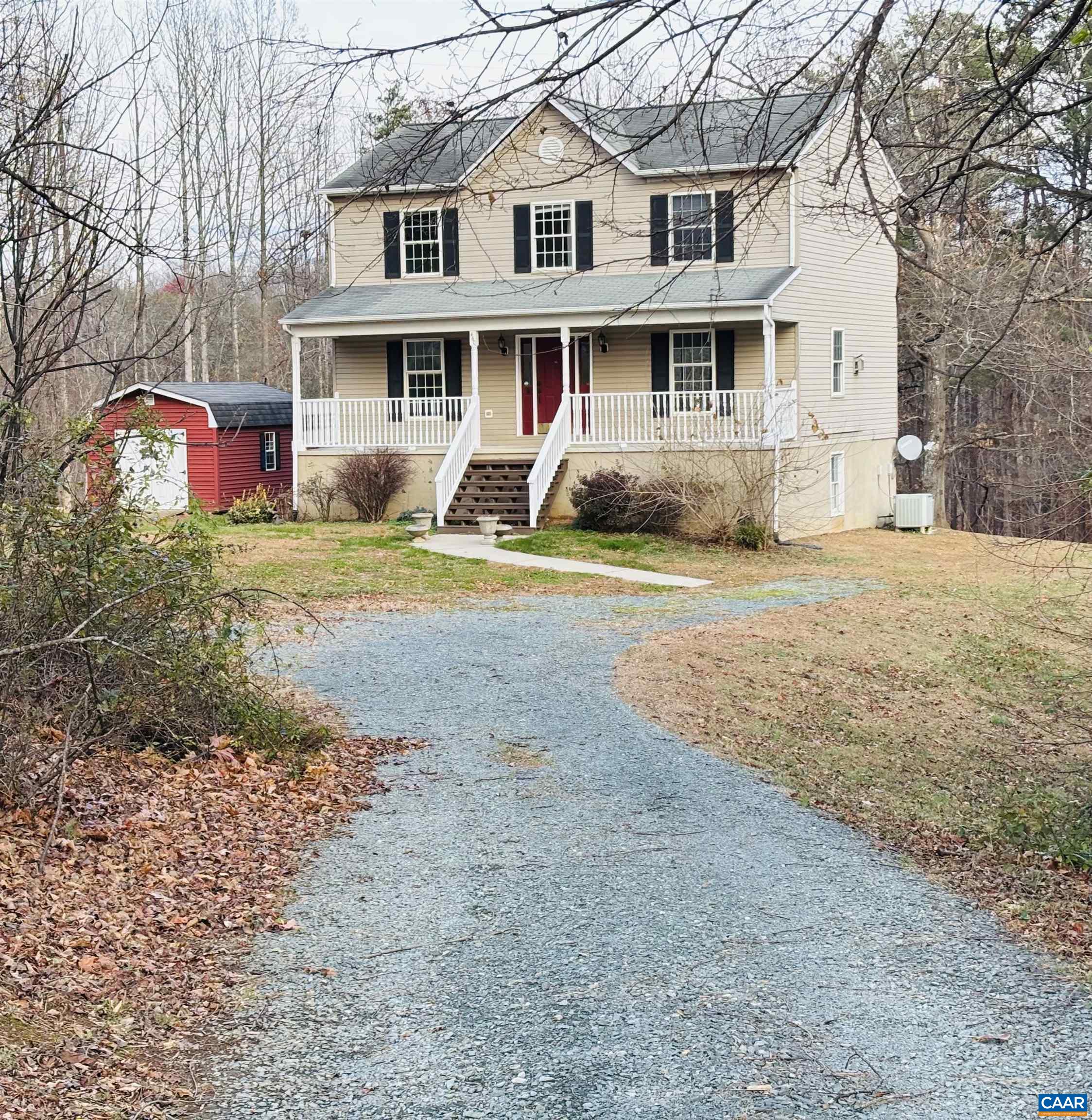 460 Twinkling Springs Road Greenwood, VA 22943 - Photo 2 of 14 a front view of a house with a yard and garage