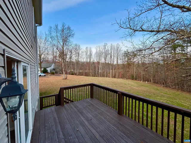 a view of balcony with wooden floor