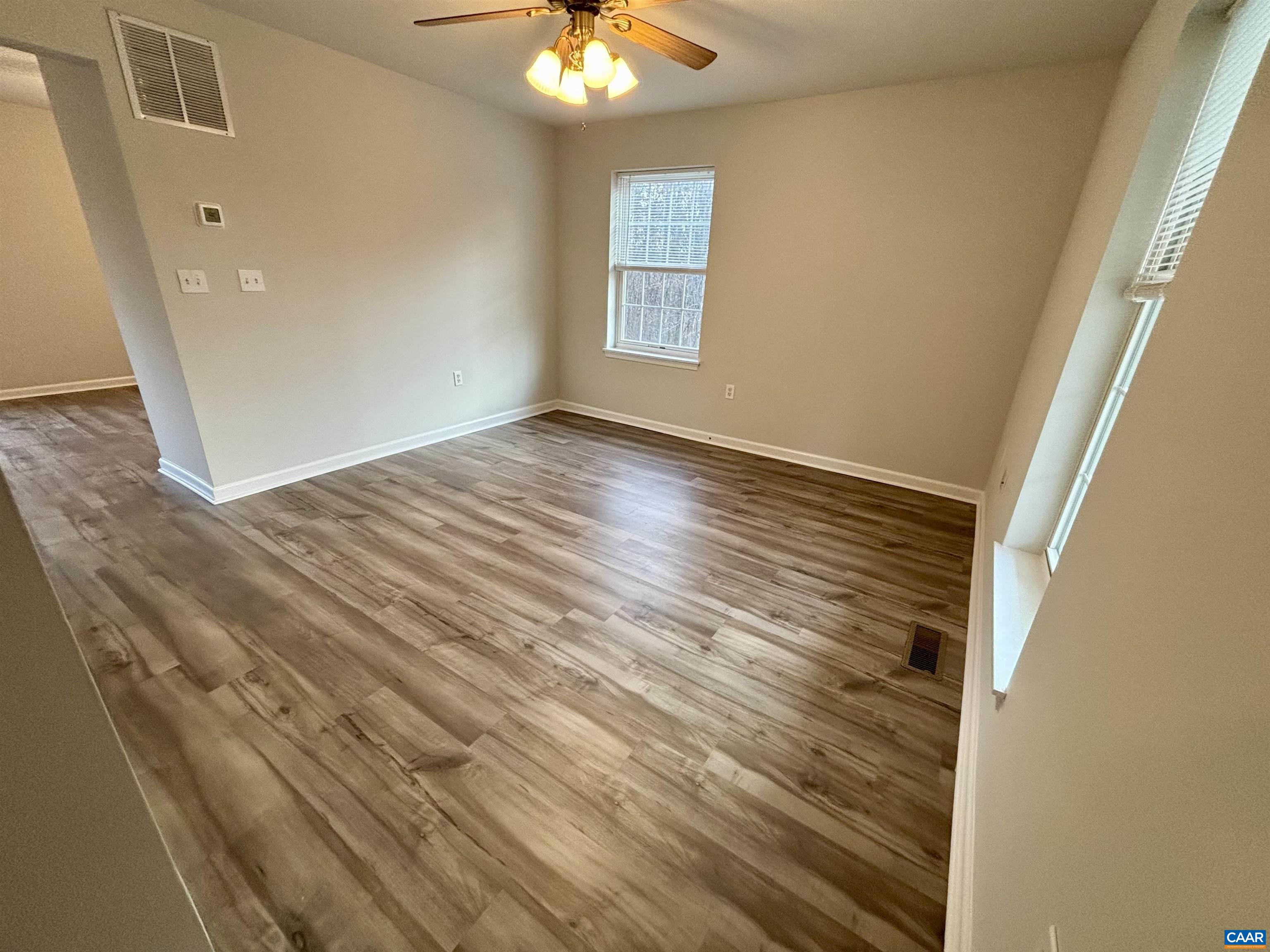 460 Twinkling Springs Road Greenwood, VA 22943 - Photo 4 of 14 en empty room with wooden floor and fan