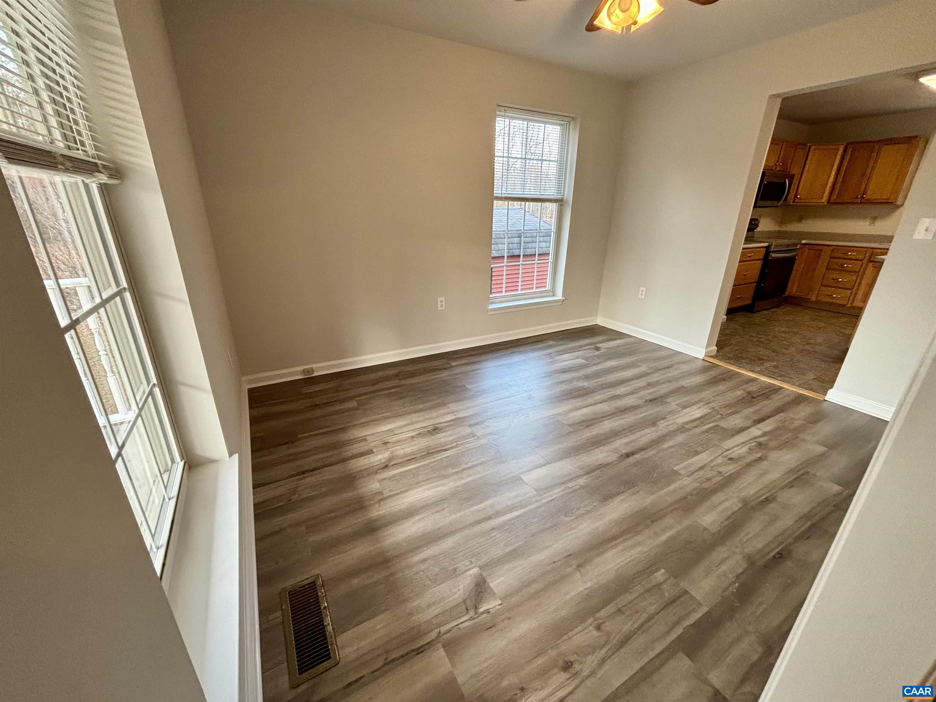 460 Twinkling Springs Road Greenwood, VA 22943 - Photo 5 of 14 a view of an empty room with wooden floor and a window